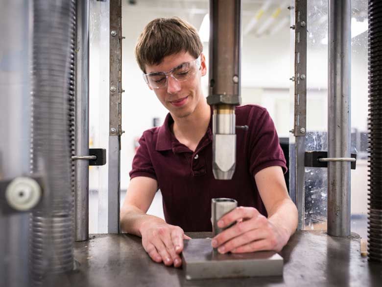 A Penn State Behrend student learns hands-on in an engineering lab.