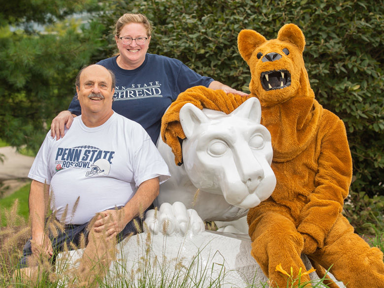 Vistors at Behrend Lion Shrine with Lion Mascot during Parents, Families, and Alumni Weekend