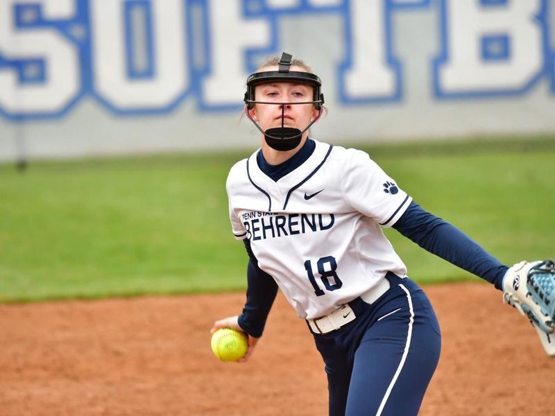 A pitcher for the Penn State Behrend softball team prepares to throw the ball.